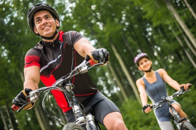 l young sporty couple riding bicycles forest road 85574 5431