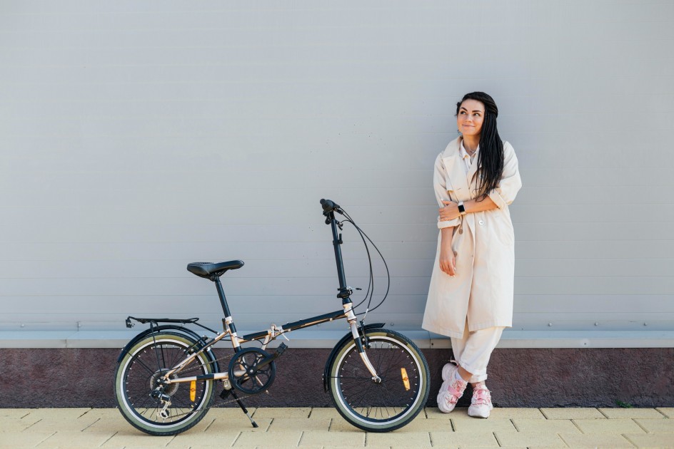 l stylish adult woman posing with eco friendly bike